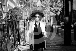 Young black woman with afro hairstyle with aviator sunglasses