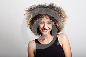 Young black woman with afro hairstyle smiling