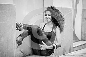 Young black woman, afro hairstyle, in urban background
