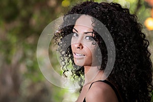 Young black woman, afro hairstyle, in urban background