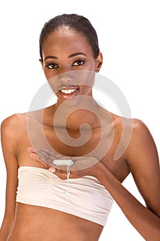 Young black woman with cotton hygienic tampon