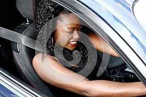 Young Black Woman Driving in Safety Seat Belt