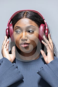Young Black Woman Enjoying Music with Headphones