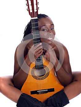 Young black woman implied nude behind guitar