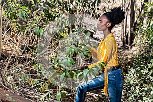 Young black woman observing nature photo