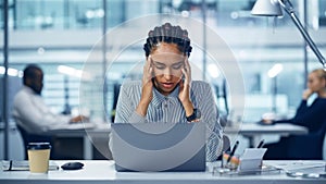 Young Black Woman Office Worker Uses Laptop, Feels Sudden Burst of Pain, Headache, Migraine. Overw