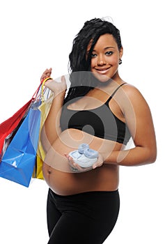 Young Black Woman pregnant with shopping bags