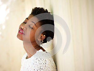 Young black woman resting with eyes closed