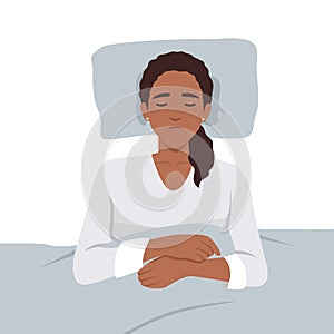 Young black woman sleeping on the bed. Female lying on comfortable bed. Concept of healthy sleeping, resting, relaxation, good