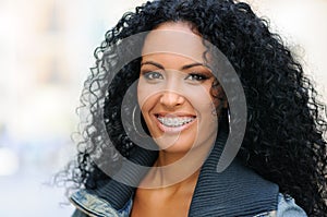 Young black woman smiling with braces