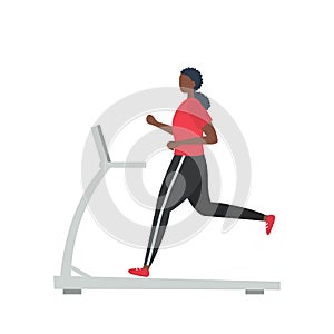 Young black woman in a sporty uniform is running on a treadmill