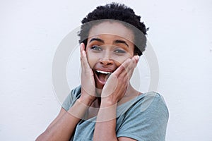 Young black woman with surprised expression on face