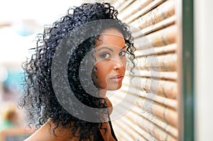 Young black woman in urban background