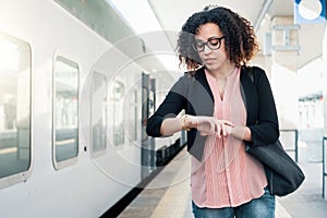 Young black woman waiting for the train