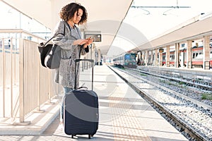 Young black woman waiting for the train