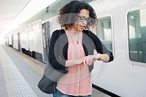 Young black woman waiting for the train