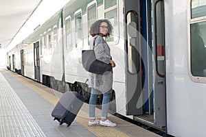 Young black woman waiting for the train