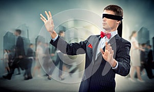 Young blindfolded man