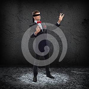 Young blindfolded man