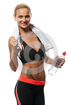 Young blond beautiful woman with bottle of water