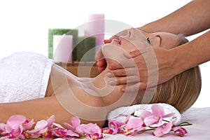 Young, blond caucasian woman in treatment at spa