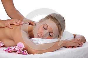 Young, blond caucasian woman in treatment at spa