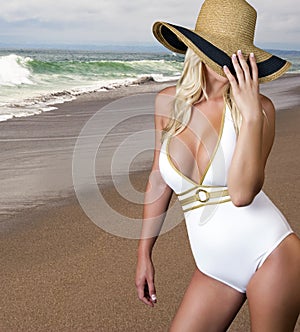 Young blond female on the beach photo