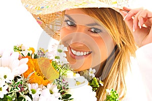 Young blond girl with flowers