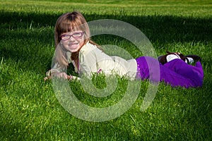 Young Blond Girl In Grass