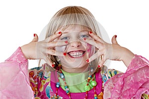 Young blond girl shows red fingernails and laughs