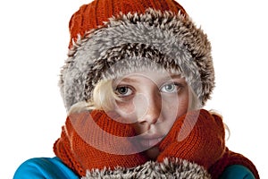 Young blond girl with winter cap and gloves