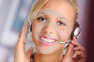 Young blond hair operator with headset