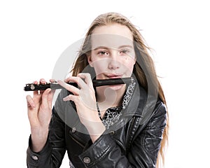 Young blond teen girl and piccolo flute in studio against white background