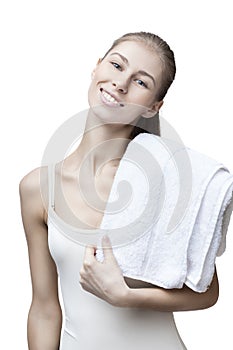 Young blond woman with bathtowel isolated on white