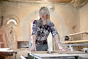 Young blond woman carpenter