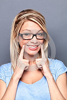 young blond woman with fake smile to show success