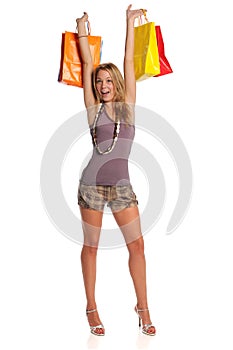 Young Blond woman holding shopping bags