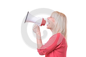 Young blond woman shouting into a megaphone