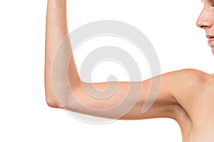 Young blond woman showing flabby arm