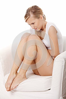 Young blond woman with stomach issues