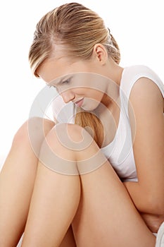 Young blond woman with stomach issues