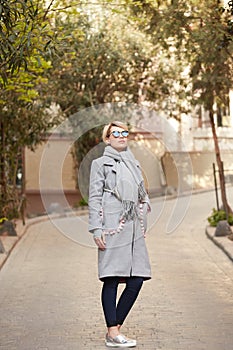 Young blond woman with sunglases on the street