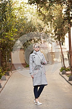 Young blond woman with sunglases on the street