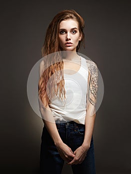 Young blond woman with tattoo