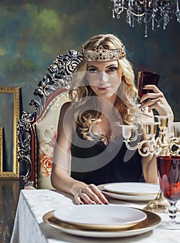 Young blond woman wearing crown in fairy luxury