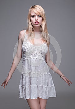 Young Blond Woman Wearing White Sun Dress