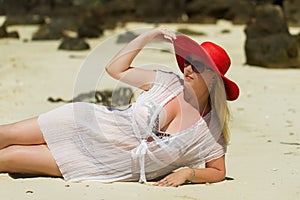 Young blonde beautiful woman at the beach in bikini