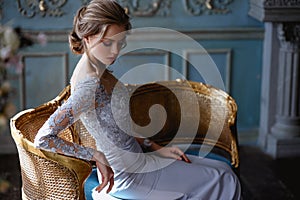 Young blonde bride woman in a light blue wedding dress