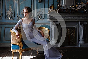 Young blonde bride woman in a light blue wedding dress