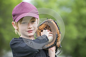 Young blonde caucasian boy ready for baseball season